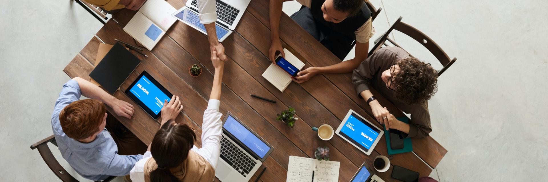 People shaking hands in a business setting
