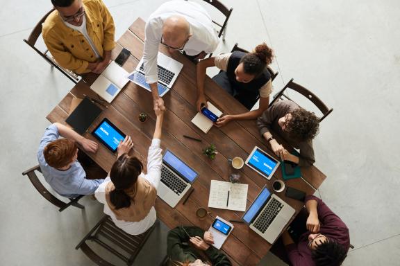 People shaking hands in a business setting